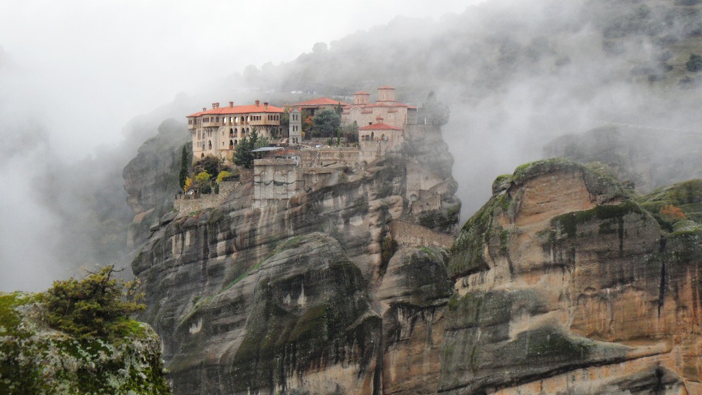 Meteora Monastery appearing through the mist