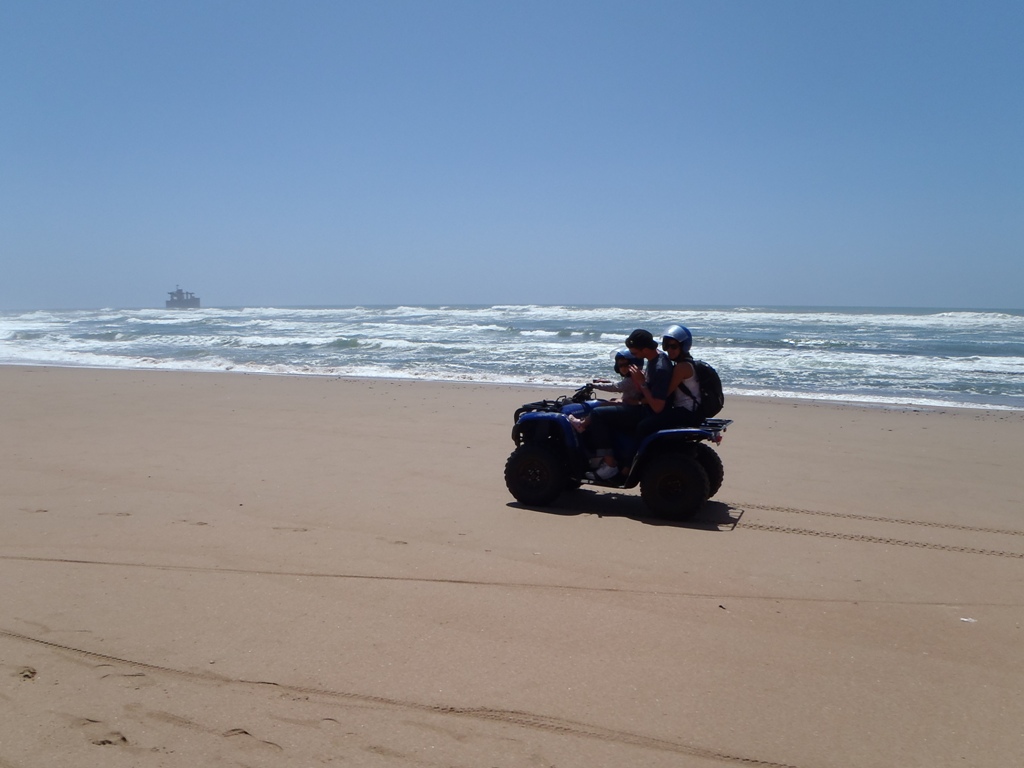 Quad biking on the beach in southern Morocco.
