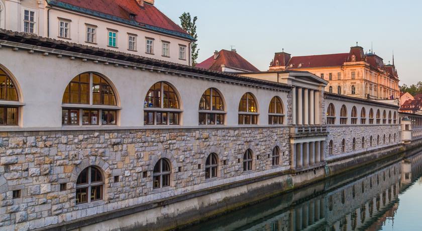 Ljubljana, collonaded market from Dragon Bridge